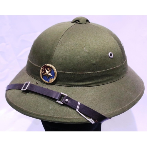 2127 - A Vietnam War period NVA sun helmet with leather chinstrap. P&P Group 2 (£18+VAT for the first lot a... 