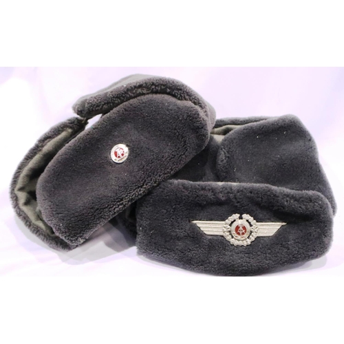 2132 - Two East German Luftwaffe ushankas. P&P Group 2 (£18+VAT for the first lot and £3+VAT for subsequent... 