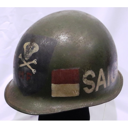 2138 - Vietnam War period US M1 helmet, found in Saigon, later painted. P&P Group 2 (£18+VAT for the first ... 