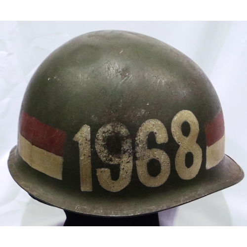 2138 - Vietnam War period US M1 helmet, found in Saigon, later painted. P&P Group 2 (£18+VAT for the first ... 