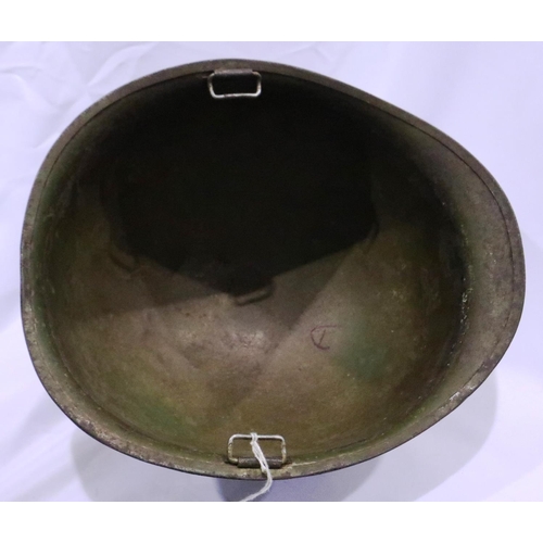 2138 - Vietnam War period US M1 helmet, found in Saigon, later painted. P&P Group 2 (£18+VAT for the first ... 