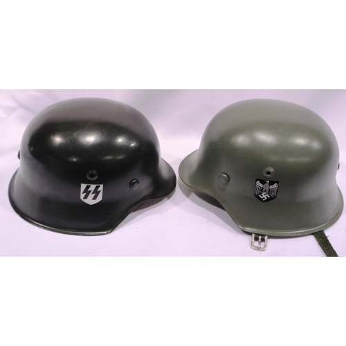 2141 - Two modern miniature German WWII steel helmets, each with leather liners. P&P Group 2 (£18+VAT for t... 