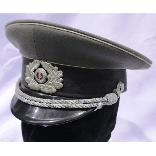 2155 - An East German Army officers visor cap with silver braid, size 56. P&P Group 2 (£18+VAT for the firs... 