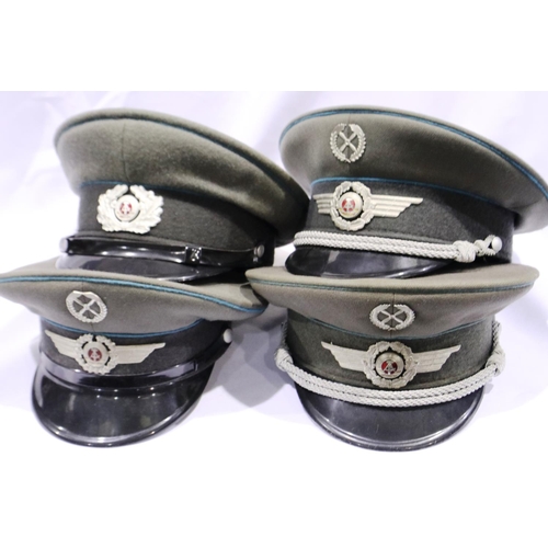 2156 - Four East German Luftwaffe officers / NCOs visor caps. P&P Group 2 (£18+VAT for the first lot and £2... 