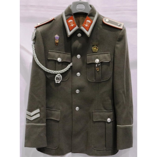 2164 - An East German NVA Paras parade tunic, with lanyard and awards. P&P Group 3 (£25+VAT for the first l... 