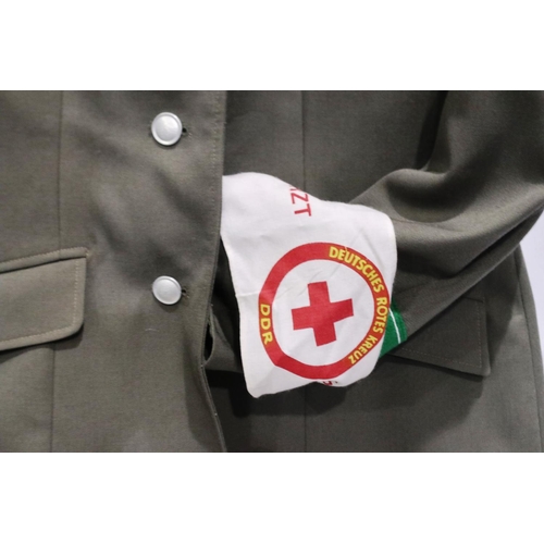 2165 - An East German NVA Medics tunic, with armband. P&P Group 3 (£25+VAT for the first lot and £5+VAT for... 