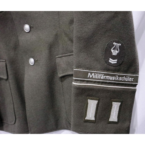 2168 - An East German NVA Bandsman parade tunic, with cuff title and awards. P&P Group 3 (£25+VAT for the f... 