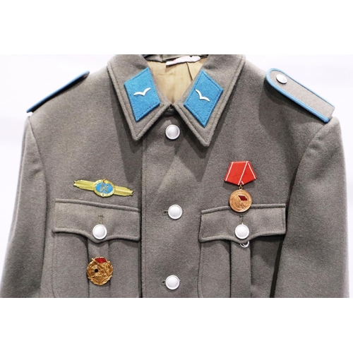 2169 - An East German NVA Luftwaffe NCOs tunic, with awards. P&P Group 3 (£25+VAT for the first lot and £5+... 