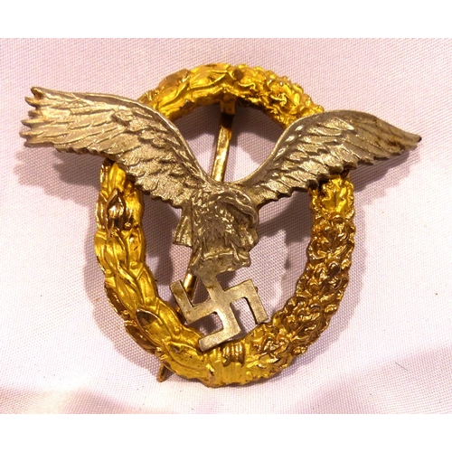 2187 - A German WWII Luftwaffe combined pilots/ observer badge, two-part construction marked Schwerin verso... 