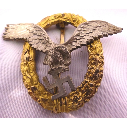 2187 - A German WWII Luftwaffe combined pilots/ observer badge, two-part construction marked Schwerin verso... 