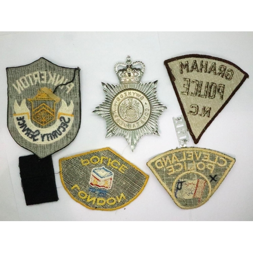 2192 - Mixed world Police Forces patches, Gwynedd Constabulary helmet plate etc. P&P Group 1 (£14+VAT for t... 