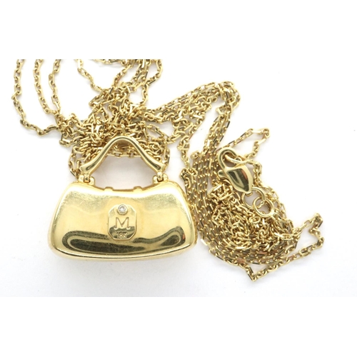 108 - Boxed Mirabelle 18ct gold and yellow diamond handbag pendant on a gold chain, with certificate of au... 