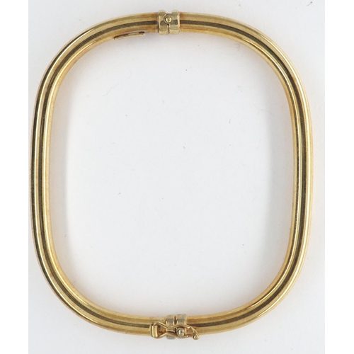 12 - An Italian 9ct gold rectangular form bangle with spring hinge and safety clasp, 65 x 55 mm, 4.5g. P&... 