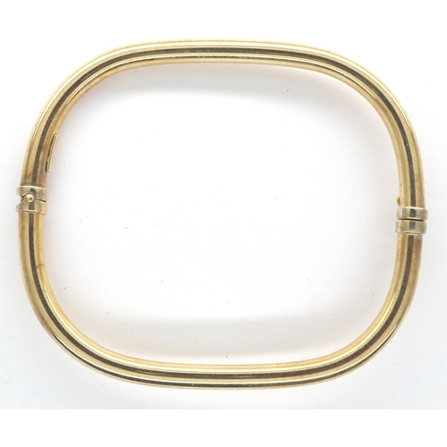 12 - An Italian 9ct gold rectangular form bangle with spring hinge and safety clasp, 65 x 55 mm, 4.5g. P&... 