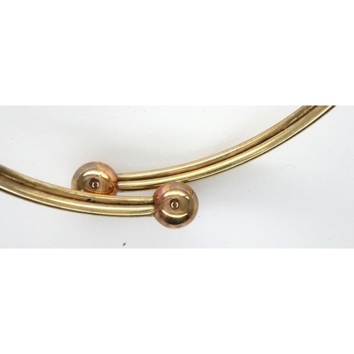 27 - A 9ct gold crossover torq style bangle, D: 65 mm, 5.5g. P&P Group 1 (£14+VAT for the first lot and £... 