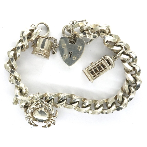 43 - Silver chain bracelet with hallmarked silver padlock clasp and three charms, L: 14 cm, combined 46g.... 