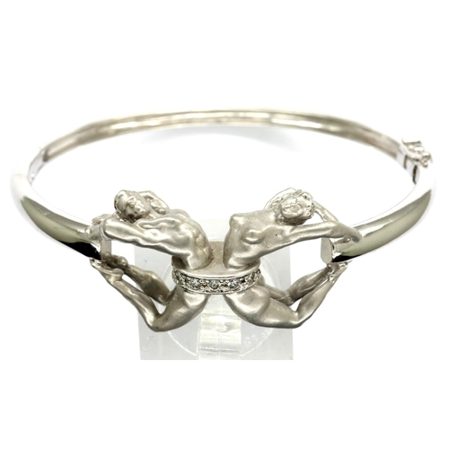 53 - Celeste designer 18ct white gold and white enamel stone set bangle, D: 60 mm, 27.4g. P&P Group 1 (£1... 