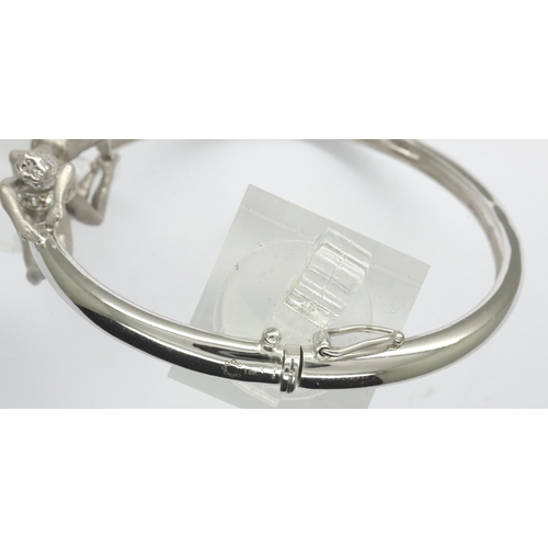 53 - Celeste designer 18ct white gold and white enamel stone set bangle, D: 60 mm, 27.4g. P&P Group 1 (£1... 