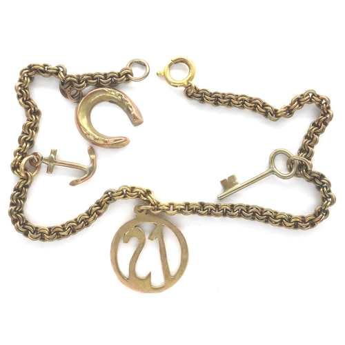 7 - 9ct gold charm bracelet, with four charms, L: 18 cm, combined 6.5g. P&P Group 1 (£14+VAT for the fir... 