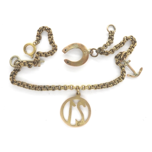 7 - 9ct gold charm bracelet, with four charms, L: 18 cm, combined 6.5g. P&P Group 1 (£14+VAT for the fir... 