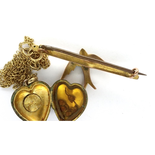 97 - A Victorian 9ct gold bar brooch, swallow set with seed pearls, L: 40 mm, 2.1g, together with a presu... 