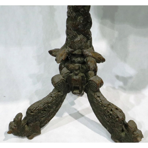 3009 - A heavily carved circular Anglo-Indian lamp table on a tripod base with mythical beasts to feet, D: ... 