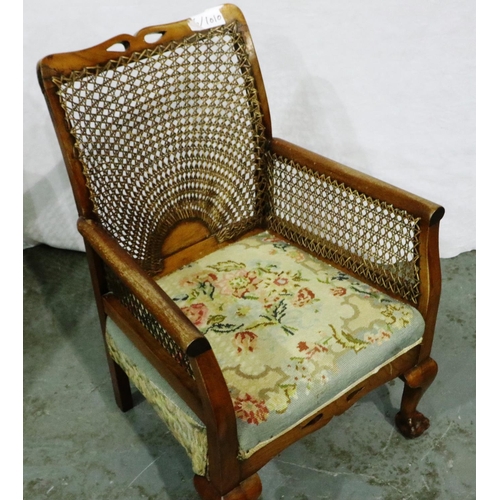 3029 - An early 20th century walnut framed salon chair with caned bergere backrest and raised on claw and b... 