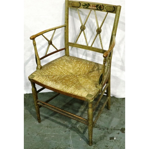 3033 - A Continental early 20th century elm chair with rush seat, stripped and printed, some old woodworm h... 