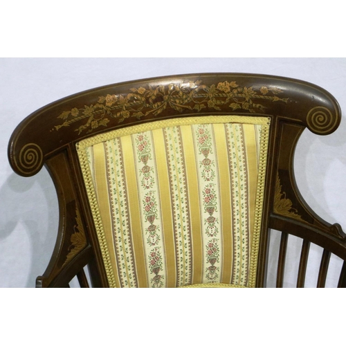 3045 - An Edwardian inlaid walnut elbow chair with circular upholstered seat and tapering supports. Not ava... 