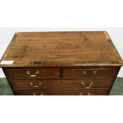 3061 - A George III inlaid walnut chest of two short above three long drawers, cross banded and raised on b... 