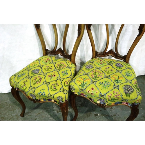 3075 - A pair of Victorian crown back chairs, each with woolwork seats. Not available for in-house P&P