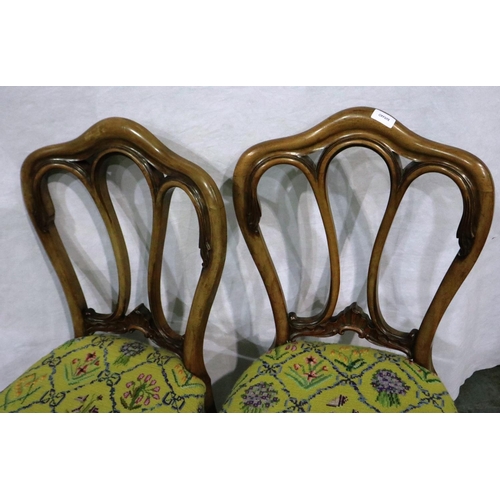 3075 - A pair of Victorian crown back chairs, each with woolwork seats. Not available for in-house P&P