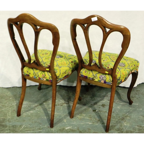 3075 - A pair of Victorian crown back chairs, each with woolwork seats. Not available for in-house P&P