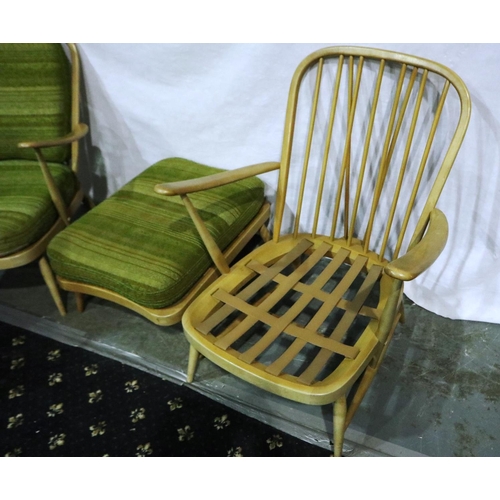 3119 - A pair of Ercol light elm lounge chairs with matching footstool, each with period cushion covers (3)... 