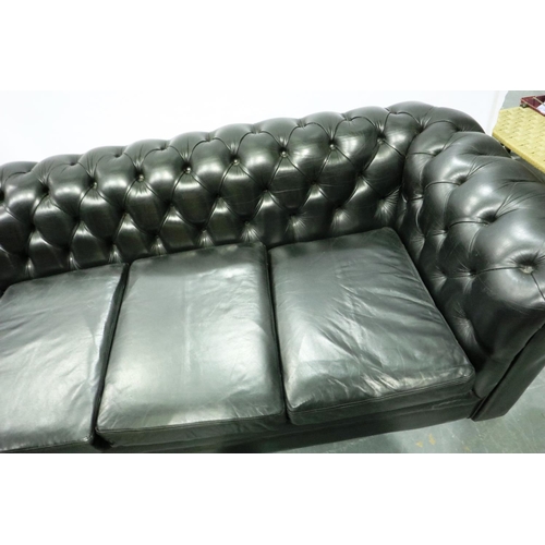 3140 - A contemporary black leather Chesterfield style sofa, four seat, L: 240 cm, good order throughout, n... 