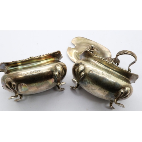 106 - Hallmarked silver open salt and mustard pot on four feet, lid to mustard pot detached but present, L... 