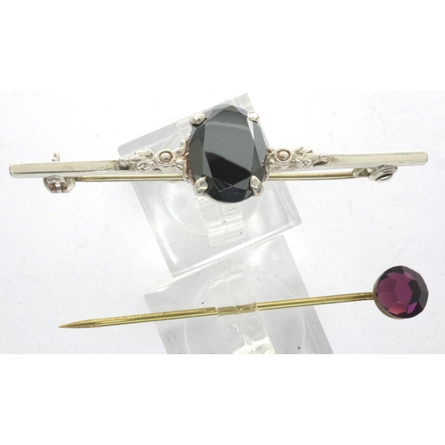 45 - Silver bar brooch set with a large dark stone, L: 46 mm, and a yellow metal stick pin. P&P Group 1 (... 