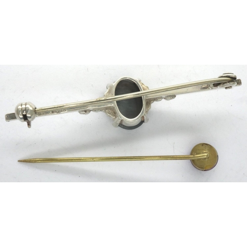 45 - Silver bar brooch set with a large dark stone, L: 46 mm, and a yellow metal stick pin. P&P Group 1 (... 