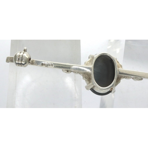 45 - Silver bar brooch set with a large dark stone, L: 46 mm, and a yellow metal stick pin. P&P Group 1 (... 