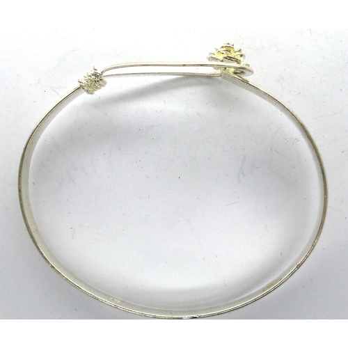 53 - Boxed 925 silver bangle with a looped clasp and floral decoration, D: 70 mm. P&P Group 1 (£14+VAT fo... 