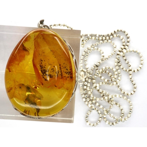 58 - Boxed 925 silver necklace with a Baltic amber pendant, chain L: 60 cm. P&P Group 1 (£14+VAT for the ... 