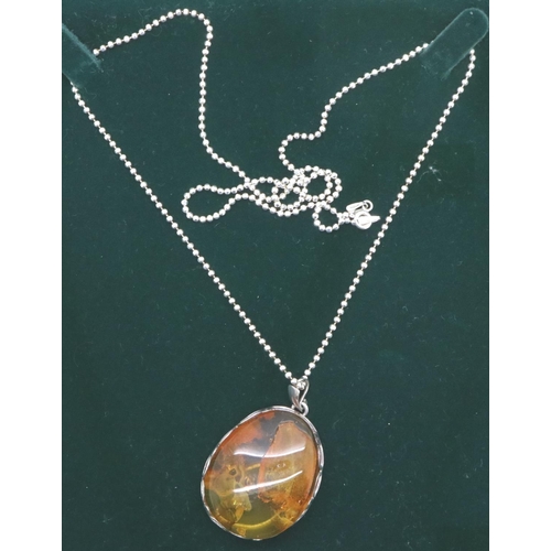 58 - Boxed 925 silver necklace with a Baltic amber pendant, chain L: 60 cm. P&P Group 1 (£14+VAT for the ... 