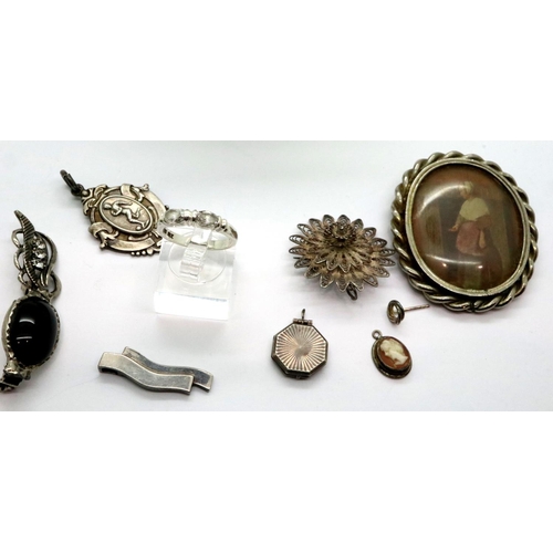 100 - Small quantity of silver including small stemmed dish, brooches, pendants etc, combined 129g. P&P Gr... 