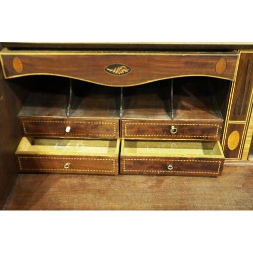 3100 - George III inlaid walnut bureau, the fall front with a complex interior of drawers, pigeon holes and... 