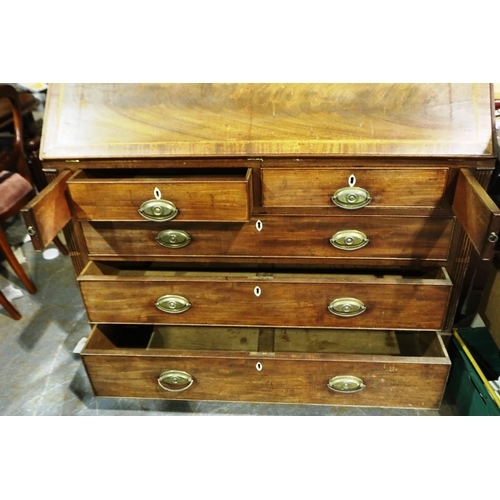 3100 - George III inlaid walnut bureau, the fall front with a complex interior of drawers, pigeon holes and... 