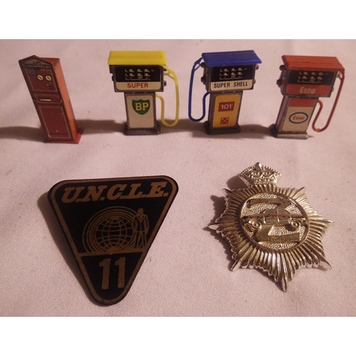 2035 - Man from uncle no11 badge plus Z cars badge, also three vintage petrol pumps and a Hornby O gauge ti... 