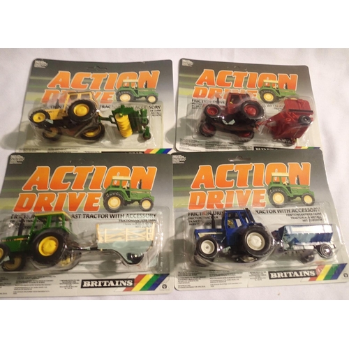 2044 - Four Britians action drive tractor and implement set in blister packs in excellent to mint condition... 