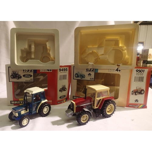 2048 - Two Britains tractors to include 9495- Ford 2120 and 9501-MF 3680 both are as new but have fading/ye... 