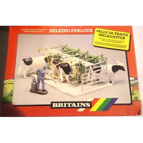 2041 - Three Britains 4710 milking parlour in excellent to near mint condition, in trade box, some storage ... 