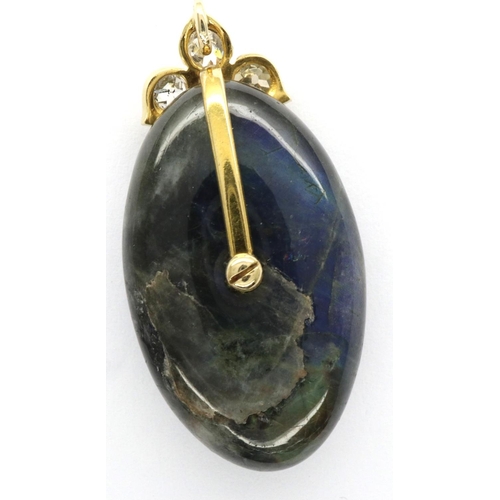 10 - Labradorite and 0.6ct old cut diamond pendant set in an 18ct gold mount, H: 35 mm, 8.6g. P&P Group 1... 